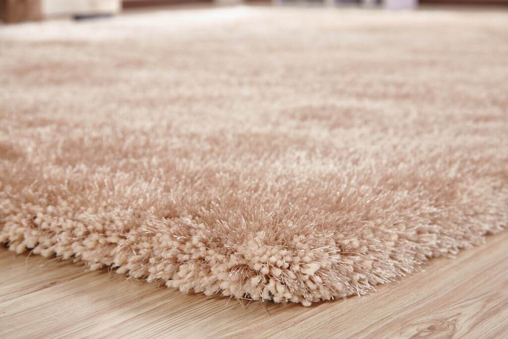 Chubby Beige Area Rug showcasing soft shaggy texture and solid color design, perfect for home decor.