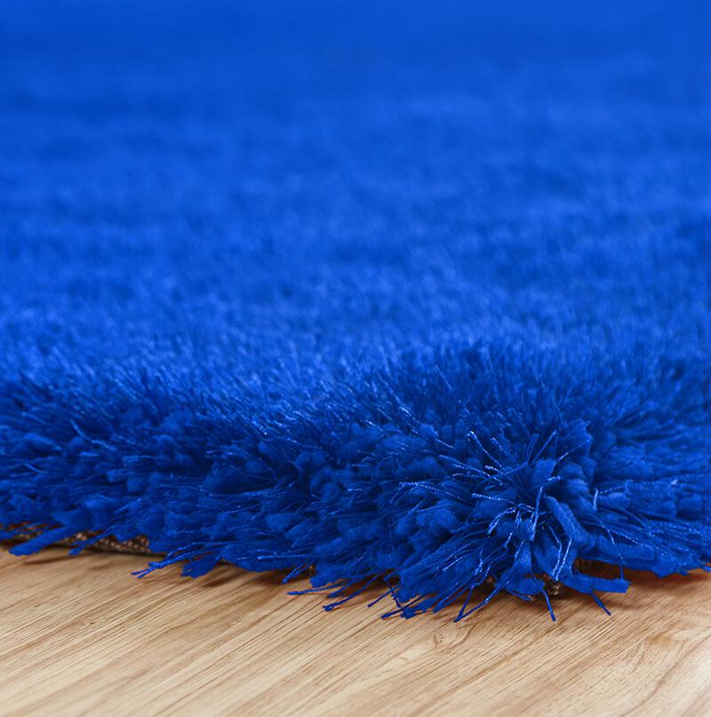 Chubby Blue Area Rug showcasing a soft shaggy texture in solid blue color, perfect for home decor.