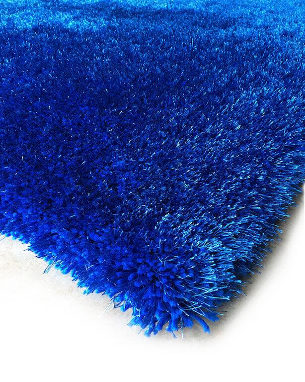 Chubby Blue Area Rug showcasing a soft shaggy texture in solid blue color, perfect for home decor.