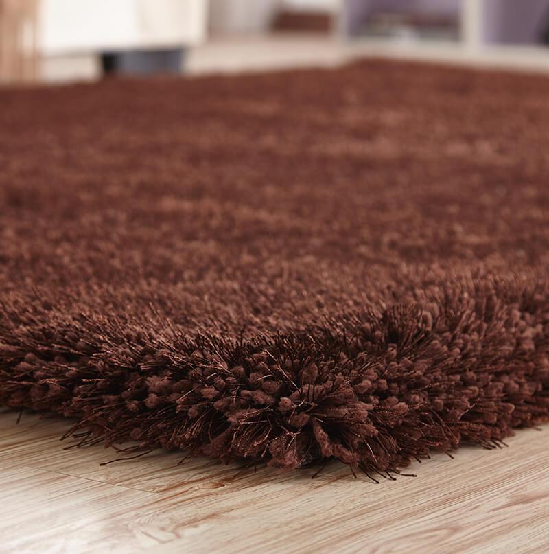 Chubby Brown Area Rug showcasing a soft shaggy texture and rich brown color, perfect for home decor.