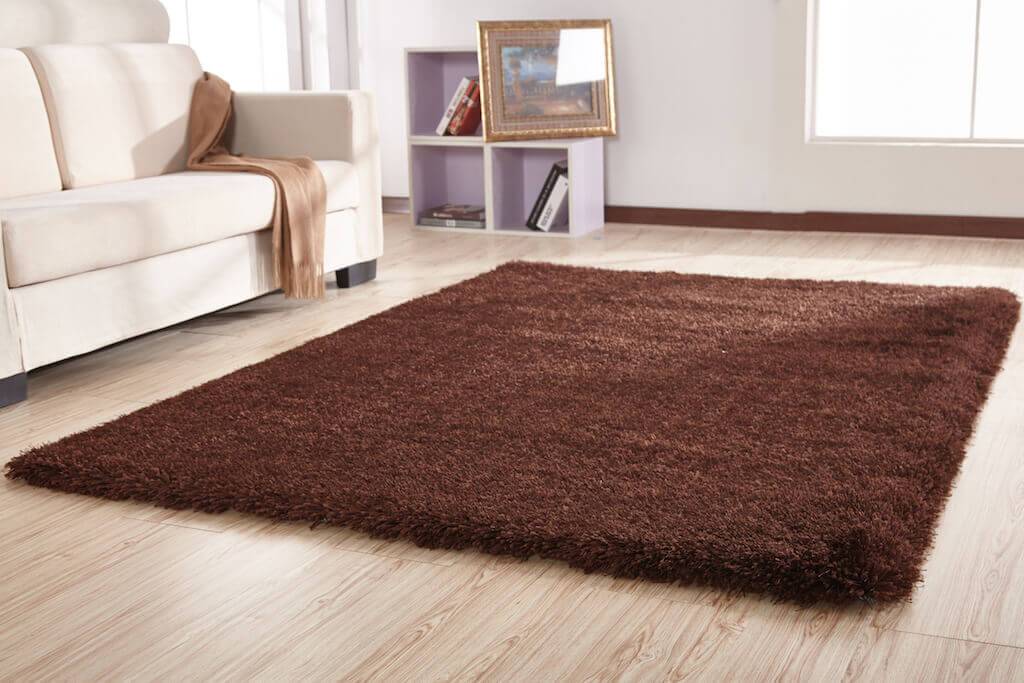 Chubby Brown Area Rug showcasing a soft shaggy texture and rich brown color, perfect for home decor.