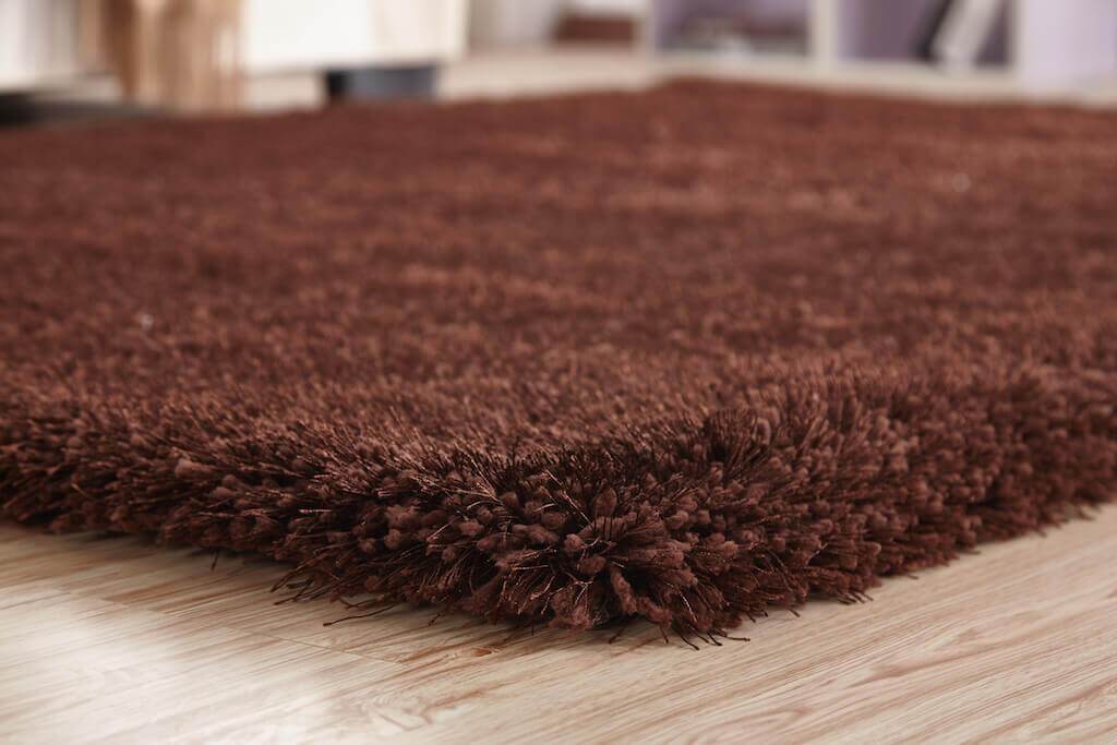 Chubby Brown Area Rug showcasing a soft shaggy texture and rich brown color, perfect for home decor.