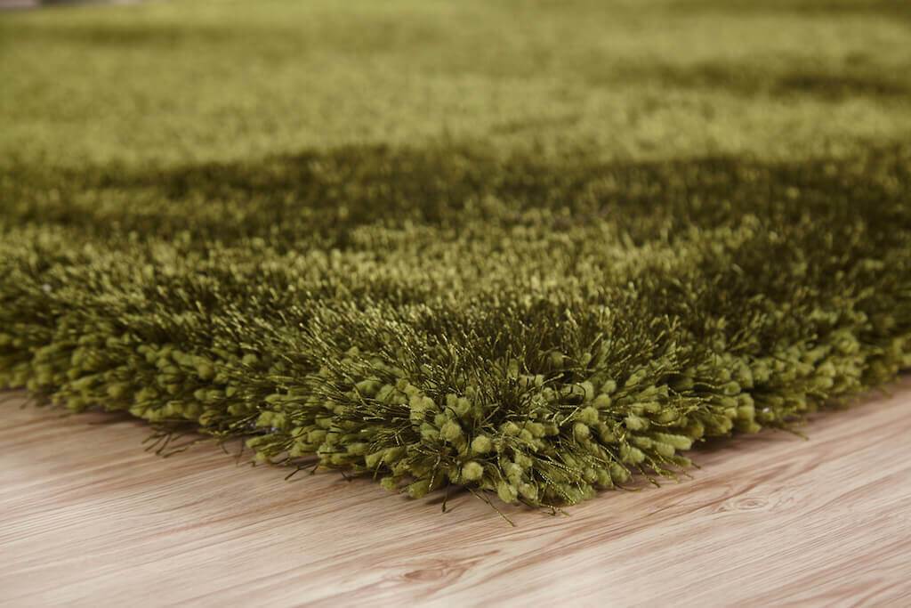 Chubby Green Area Rug showcasing a soft shaggy texture in solid green color, perfect for home decor.