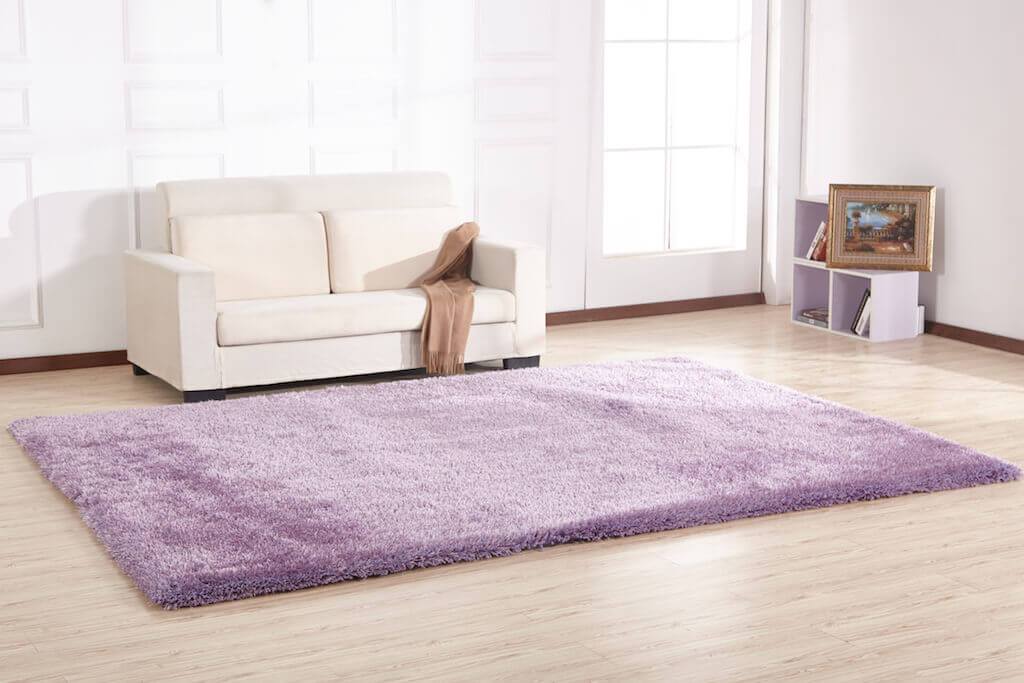 Chubby Lavender Area Rug showcasing soft shaggy texture in a cozy living space, available in two sizes.