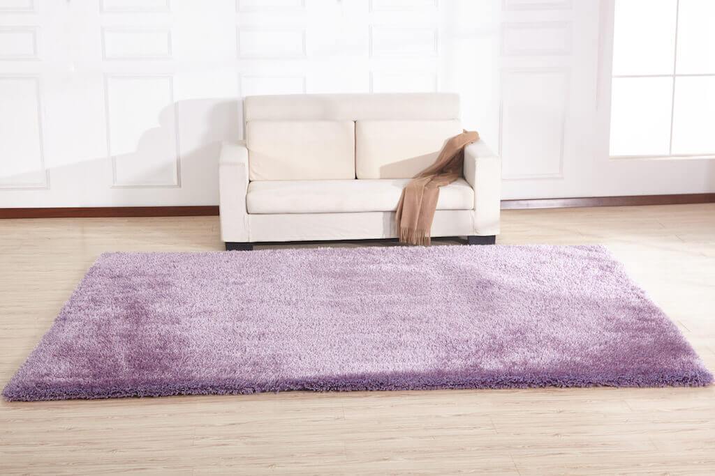 Chubby Lavender Area Rug showcasing soft shaggy texture in a cozy living space, available in two sizes.