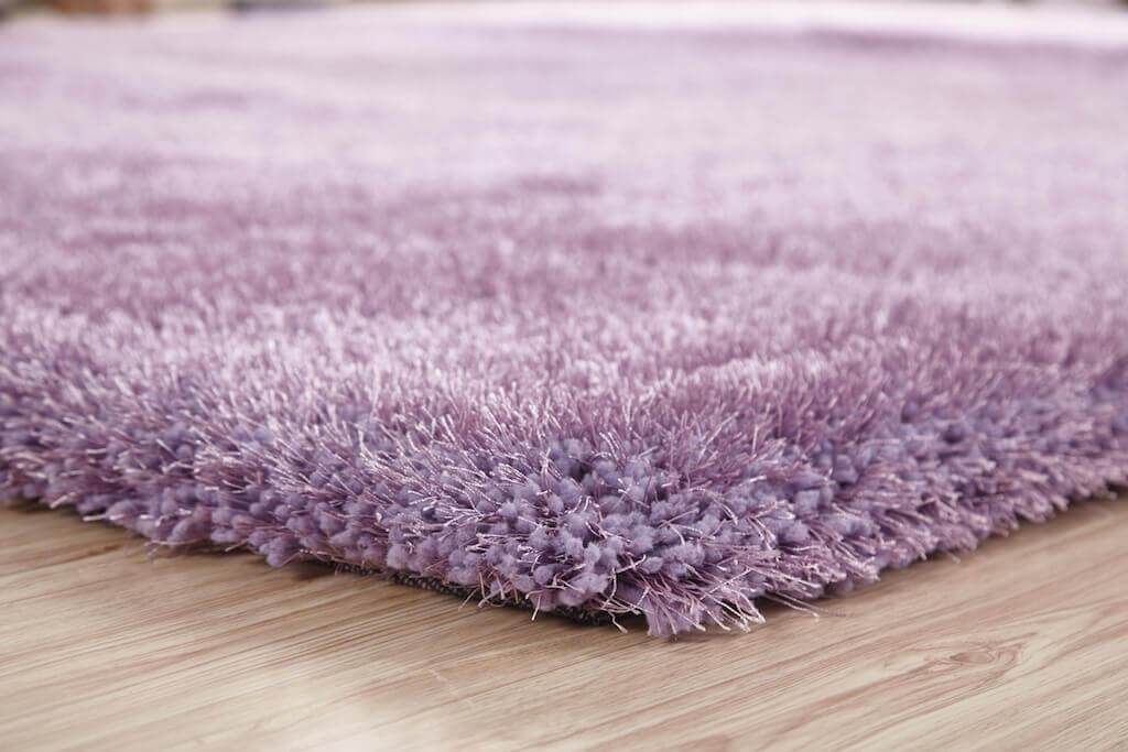 Chubby Lavender Area Rug showcasing soft shaggy texture in a cozy living space, available in two sizes.