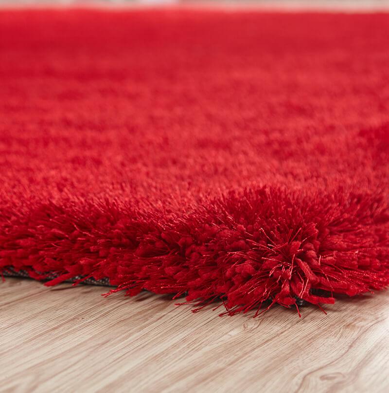 Chubby Red Area Rug showcasing a soft shaggy texture, hand-tufted design, and vibrant red color, perfect for home decor.