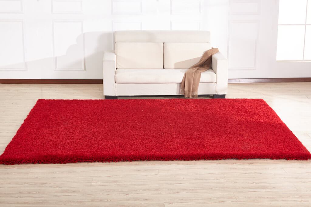 Chubby Red Area Rug showcasing a soft shaggy texture, hand-tufted design, and vibrant red color, perfect for home decor.