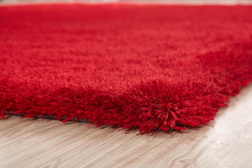 Chubby Red Area Rug showcasing a soft shaggy texture, hand-tufted design, and vibrant red color, perfect for home decor.