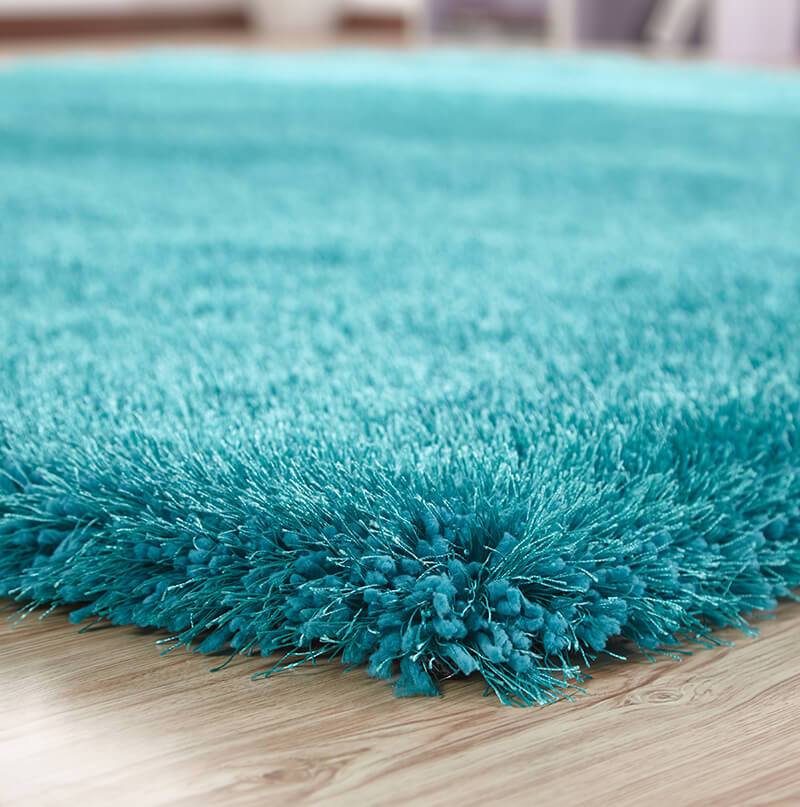 Chubby Turquoise Area Rug showcasing a soft shaggy texture and vibrant color, perfect for home decor.