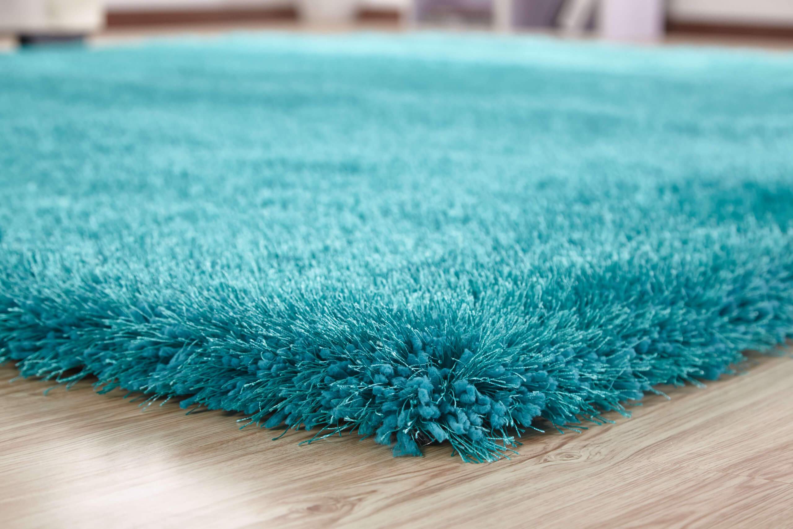 Chubby Turquoise Area Rug showcasing a soft shaggy texture and vibrant color, perfect for home decor.