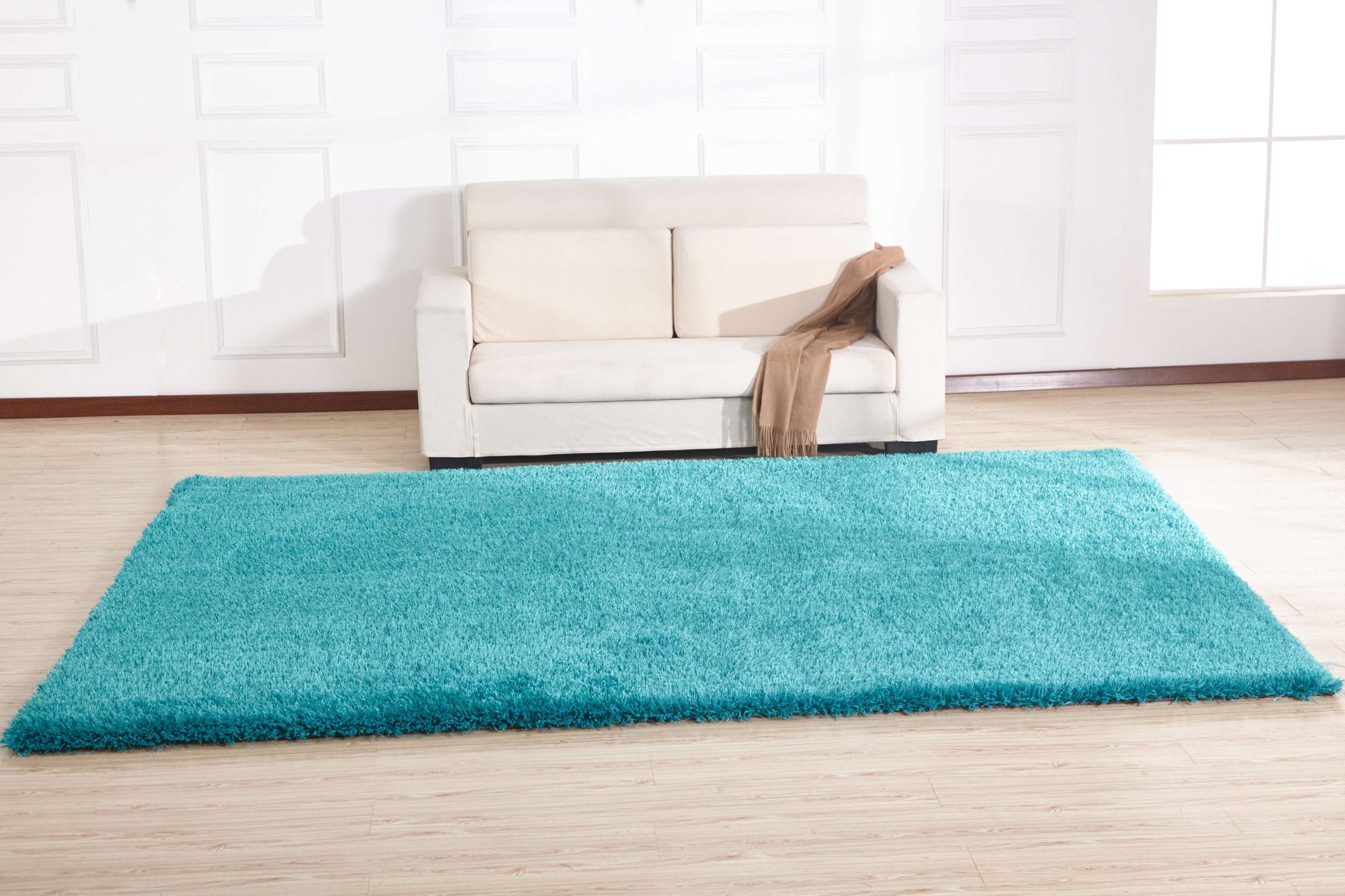 Chubby Turquoise Area Rug showcasing a soft shaggy texture and vibrant color, perfect for home decor.