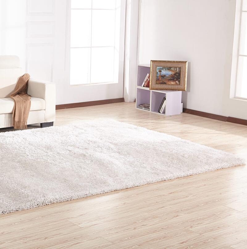 Chubby White Area Rug with soft shaggy texture, hand-tufted from 100% polyester, perfect for home decor.