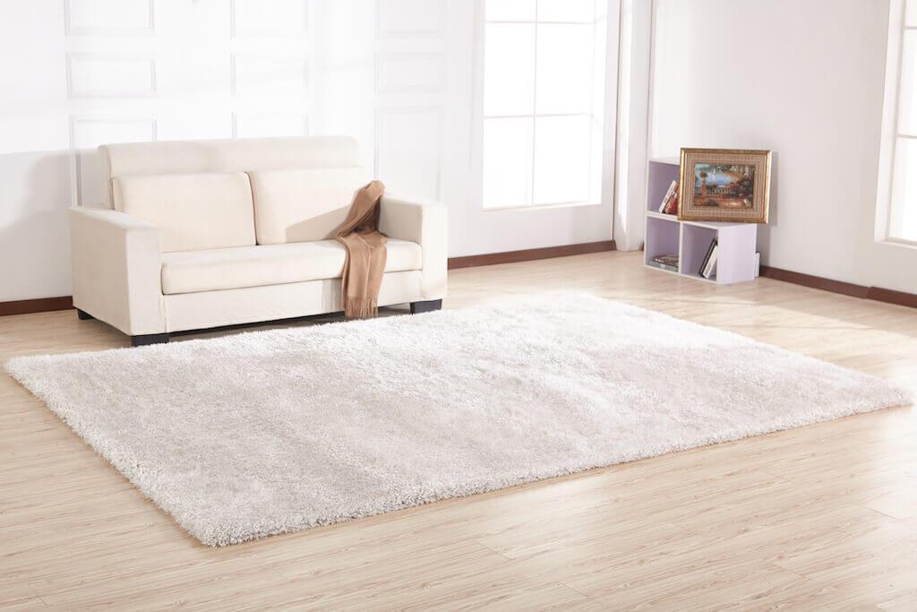 Chubby White Area Rug with soft shaggy texture, hand-tufted from 100% polyester, perfect for home decor.