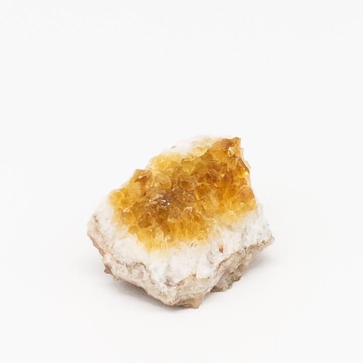 A beautiful citrine druzy crystal with sparkling golden hues, measuring between 1-4 inches, perfect for home or office decor.