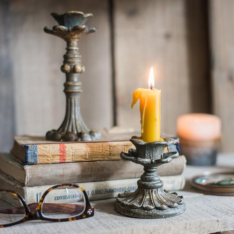 Classic French Candlestick Holder in bronze and rust color, showcasing elegant design and resin material.