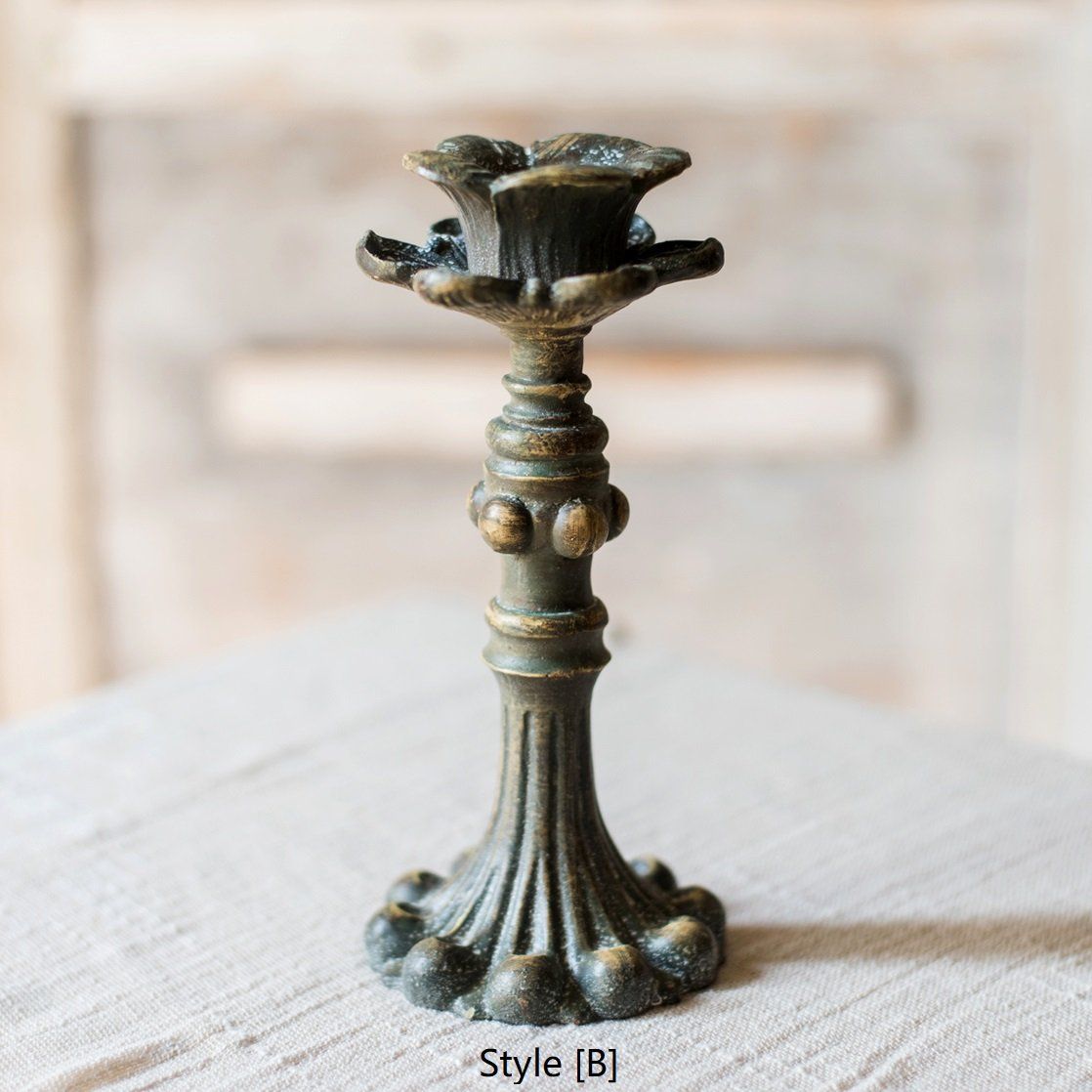 Classic French Candlestick Holder in bronze and rust color, showcasing elegant design and resin material.