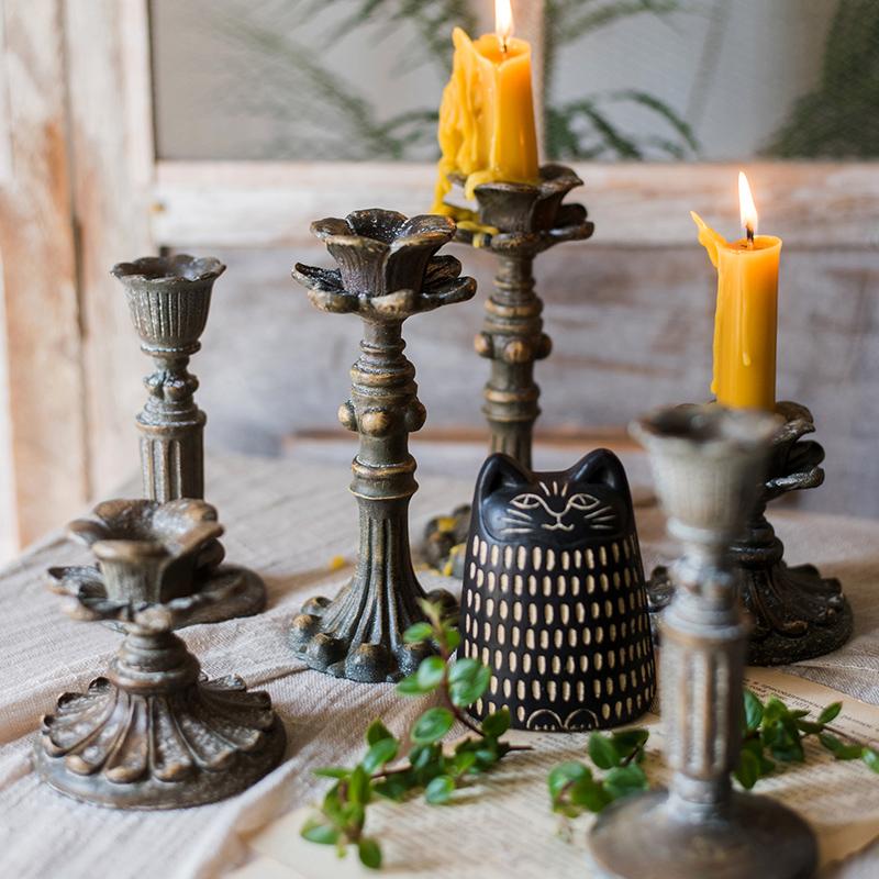 Classic French Candlestick Holder in bronze and rust color, showcasing elegant design and resin material.