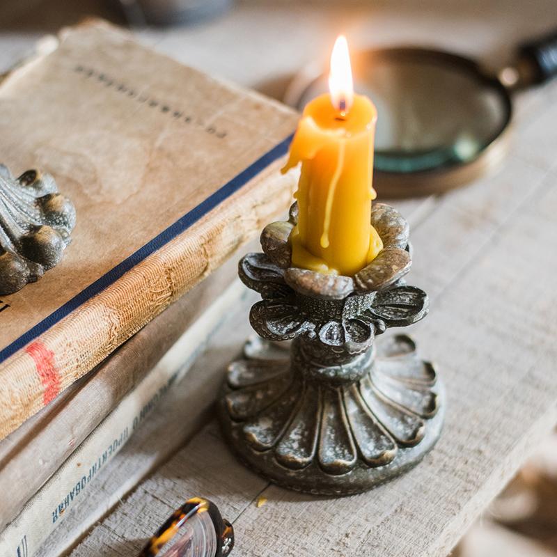 Classic French Candlestick Holder in bronze and rust color, showcasing elegant design and resin material.