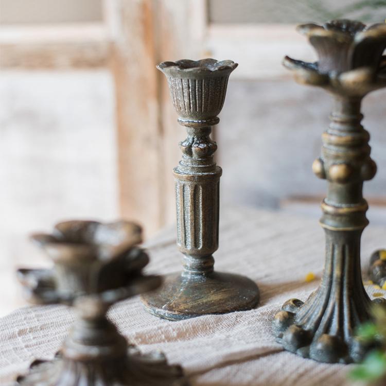 Classic French Candlestick Holder in bronze and rust color, showcasing elegant design and resin material.