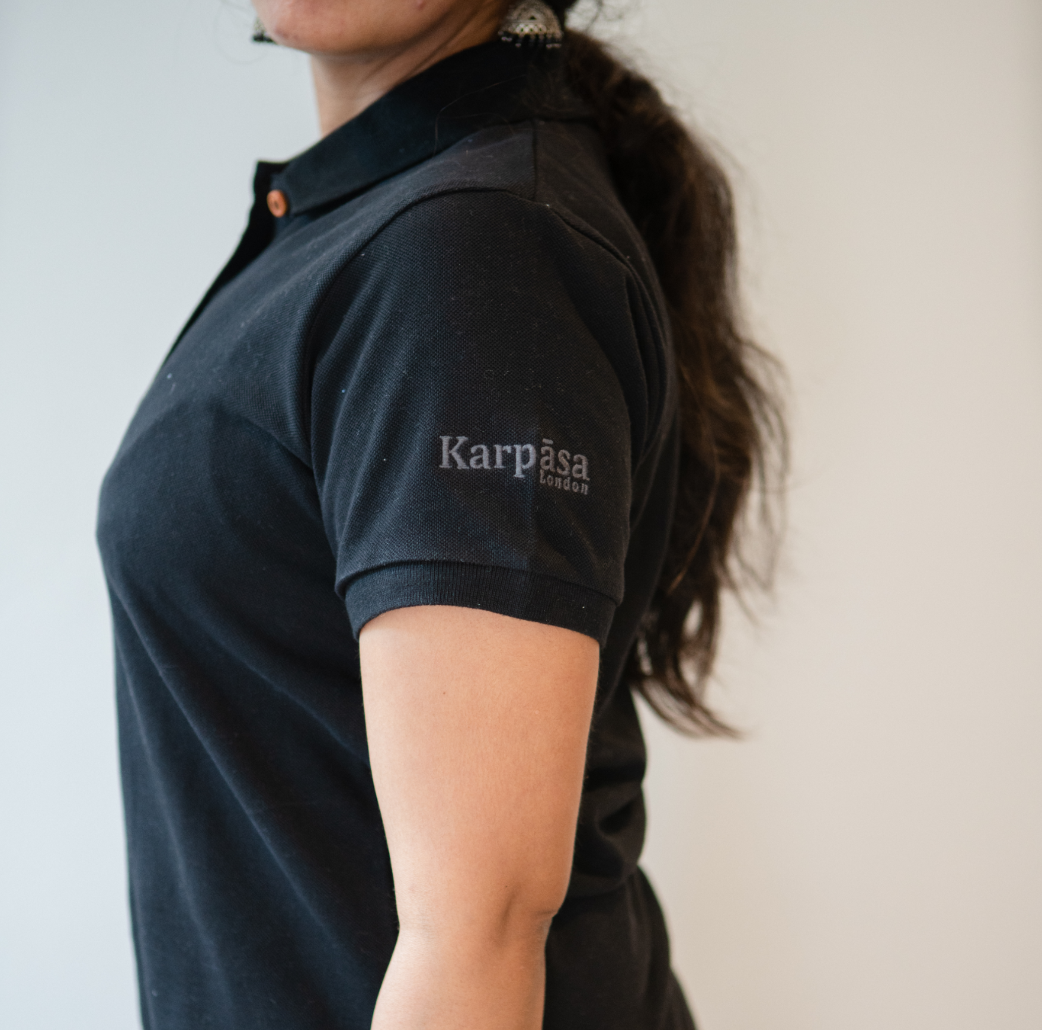 Classic Ladies Polo T-Shirt made from 100% organic cotton, featuring coconut buttons and embroidered logo on sleeves.