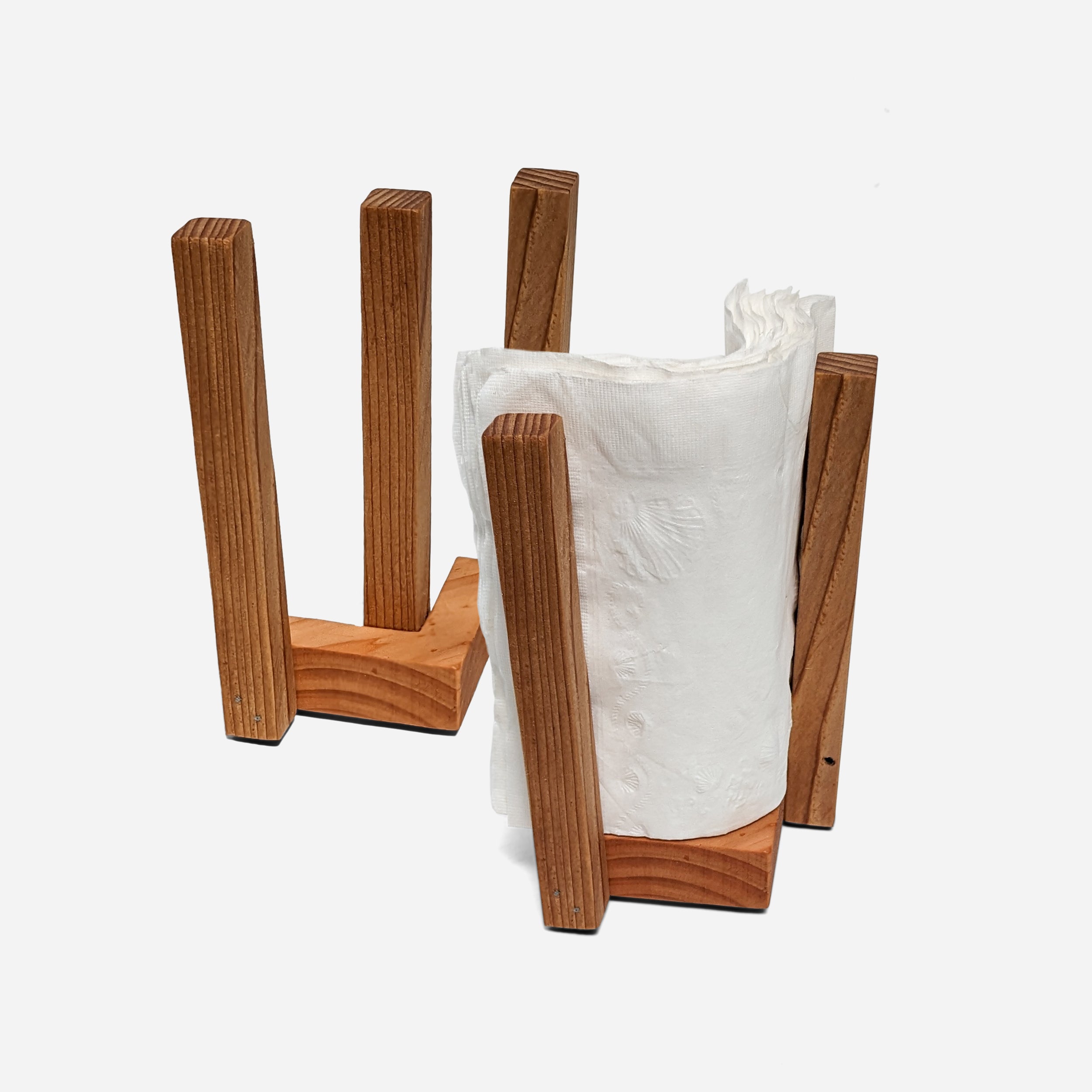 A stylish Clean napkin holder made from Doug Fir, featuring a butcher block oil finish, standing upright with napkins elegantly displayed.