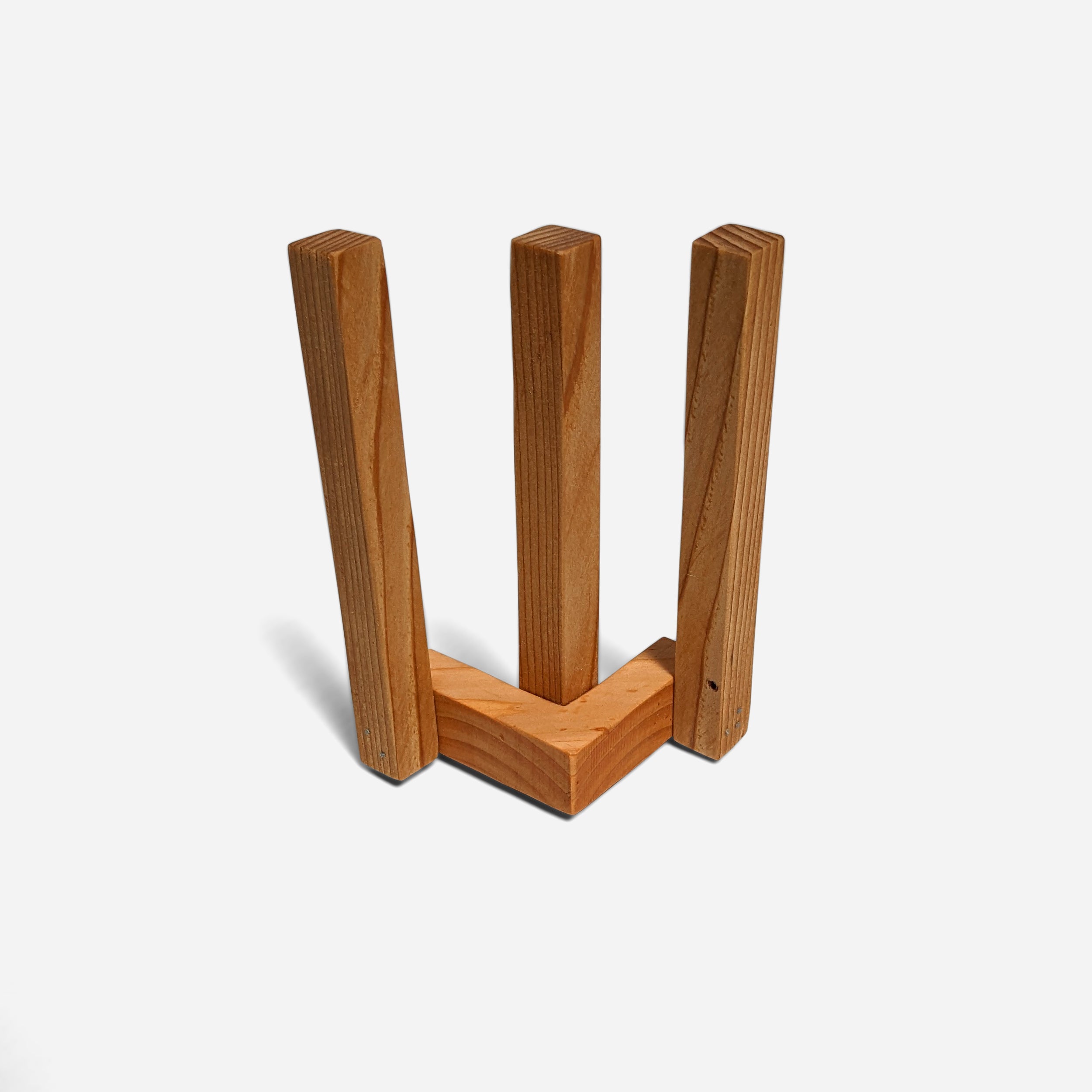 A stylish Clean napkin holder made from Doug Fir, featuring a butcher block oil finish, standing upright with napkins elegantly displayed.