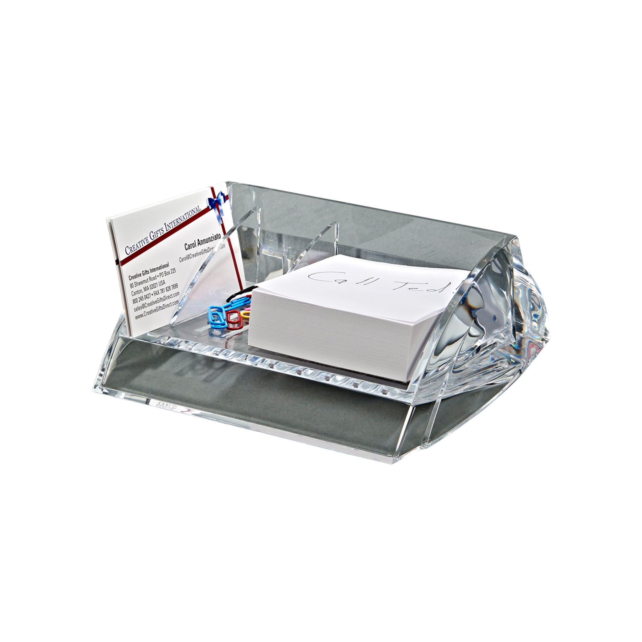 Clear acrylic desk caddy with three compartments for paper, clips, and business cards.