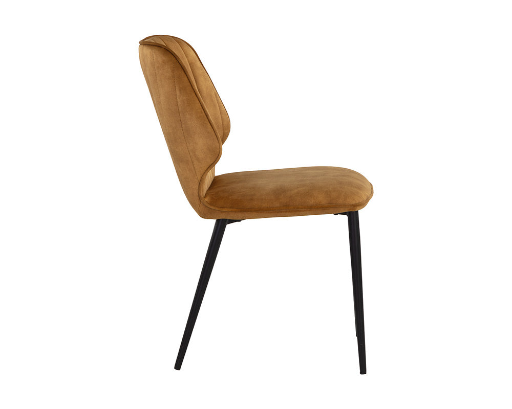 Clinton Dining Chair in Black with Nono Tapenade Gold fabric, featuring channel tufting and sturdy black iron legs.