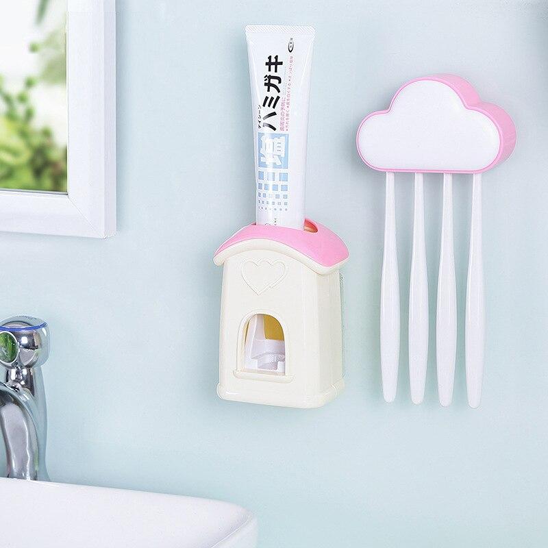 A stylish cloud-shaped toothbrush holder with a built-in toothpaste dispenser, designed for kids' bathrooms.