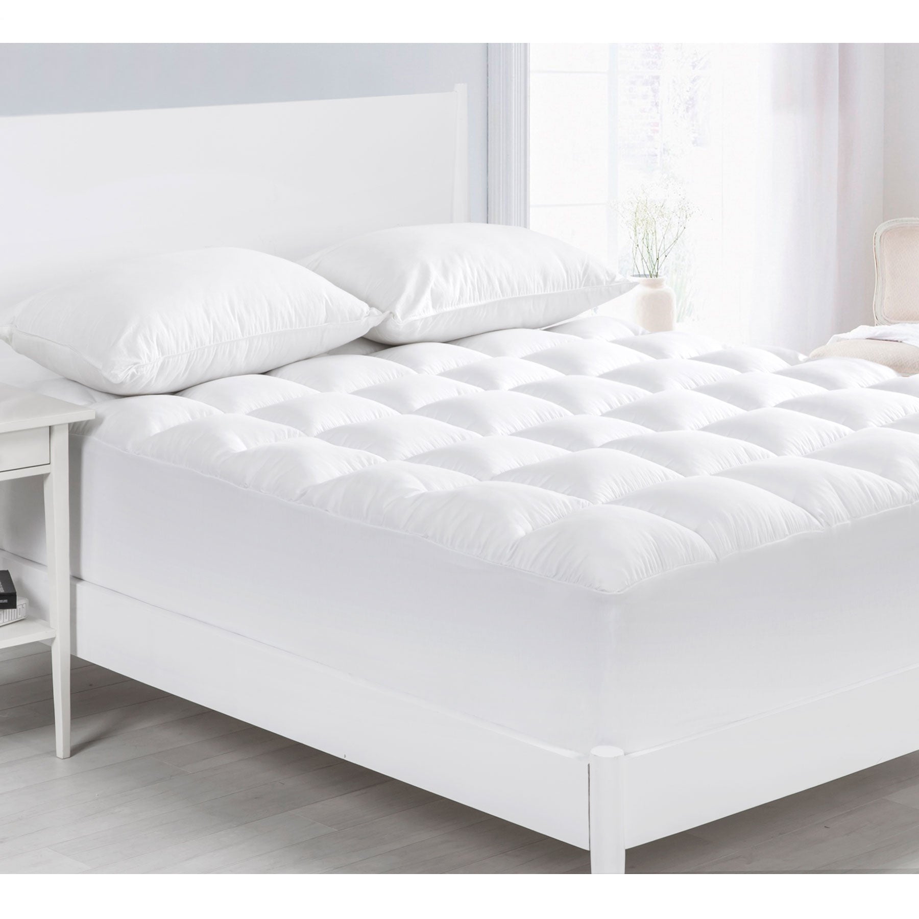 Cloudland 1000GSM Memory Resistant Microball Fill Mattress Topper featuring a square quilted design and deep stretch walls for a snug fit.