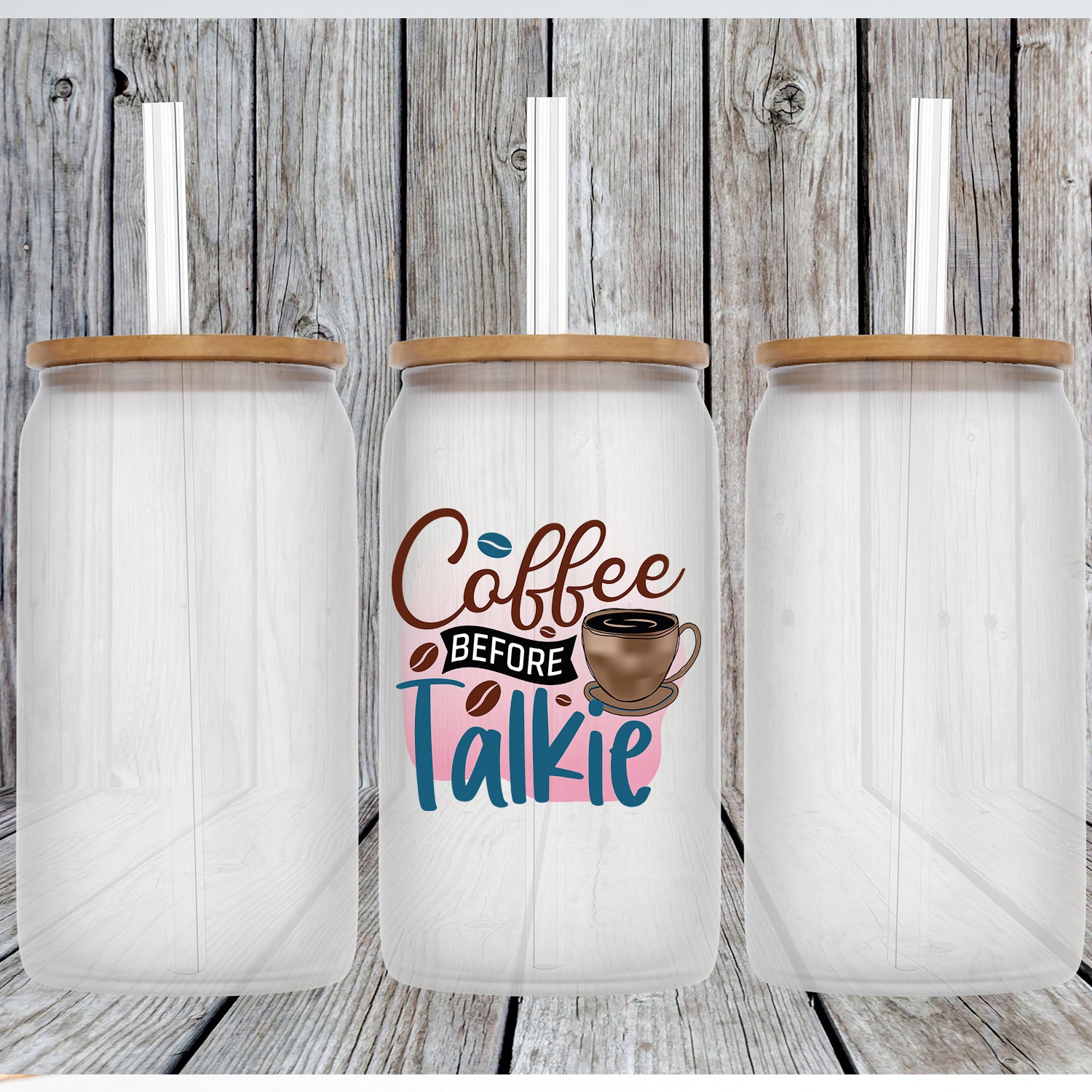 Coffee Before Talkie Glass Can Tumbler with bamboo lid and clear straw, showcasing its frosted glass design.