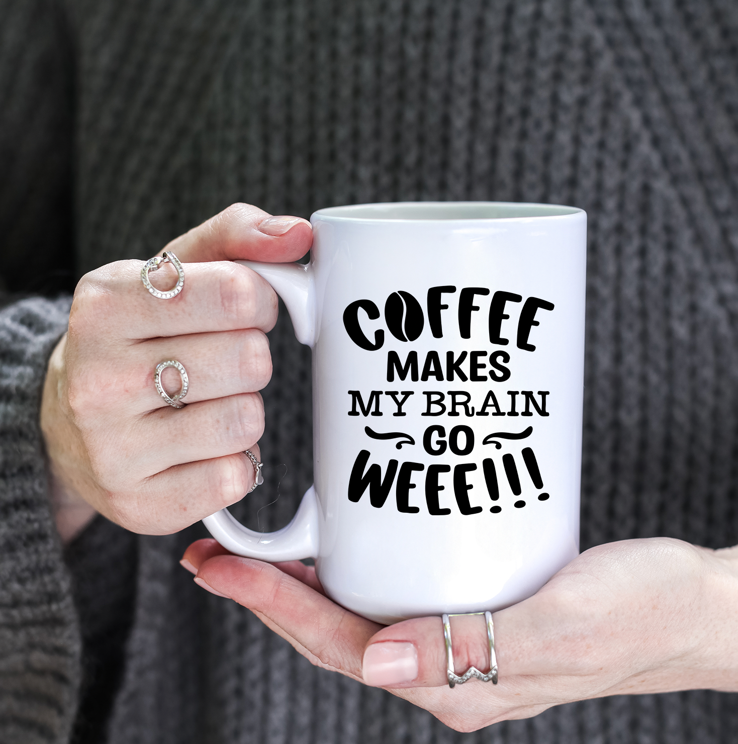 A glossy white ceramic mug with the phrase 'Coffee Makes My Brain Go Weee' printed in vibrant colors, perfect for coffee lovers.