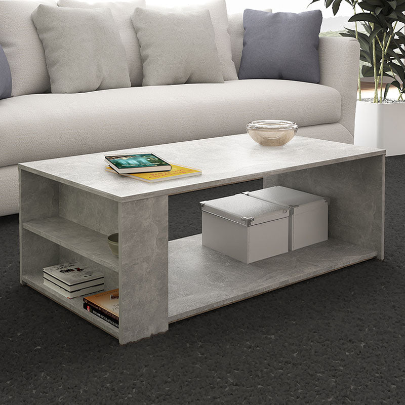 Coffee Table ANGELA in concrete grey, measuring 110x60x40 cm, showcasing a modern design with a durable melamine surface.