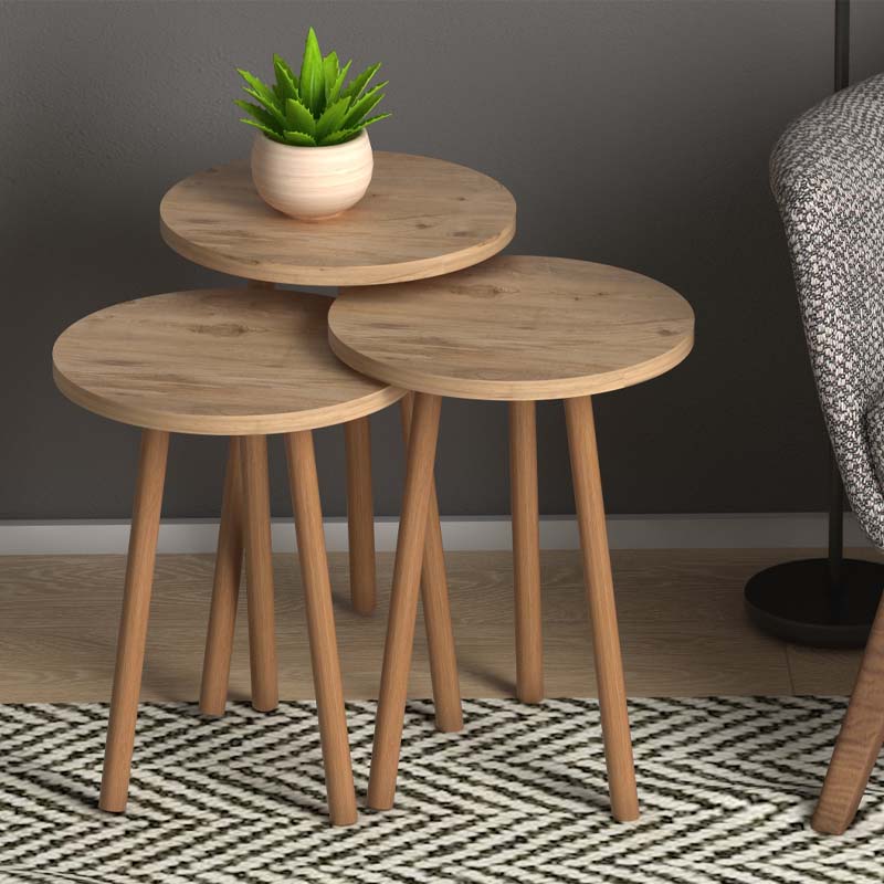 Three-piece coffee table set TINA in pine oak finish, featuring a large, medium, and small table with solid beech wood legs.