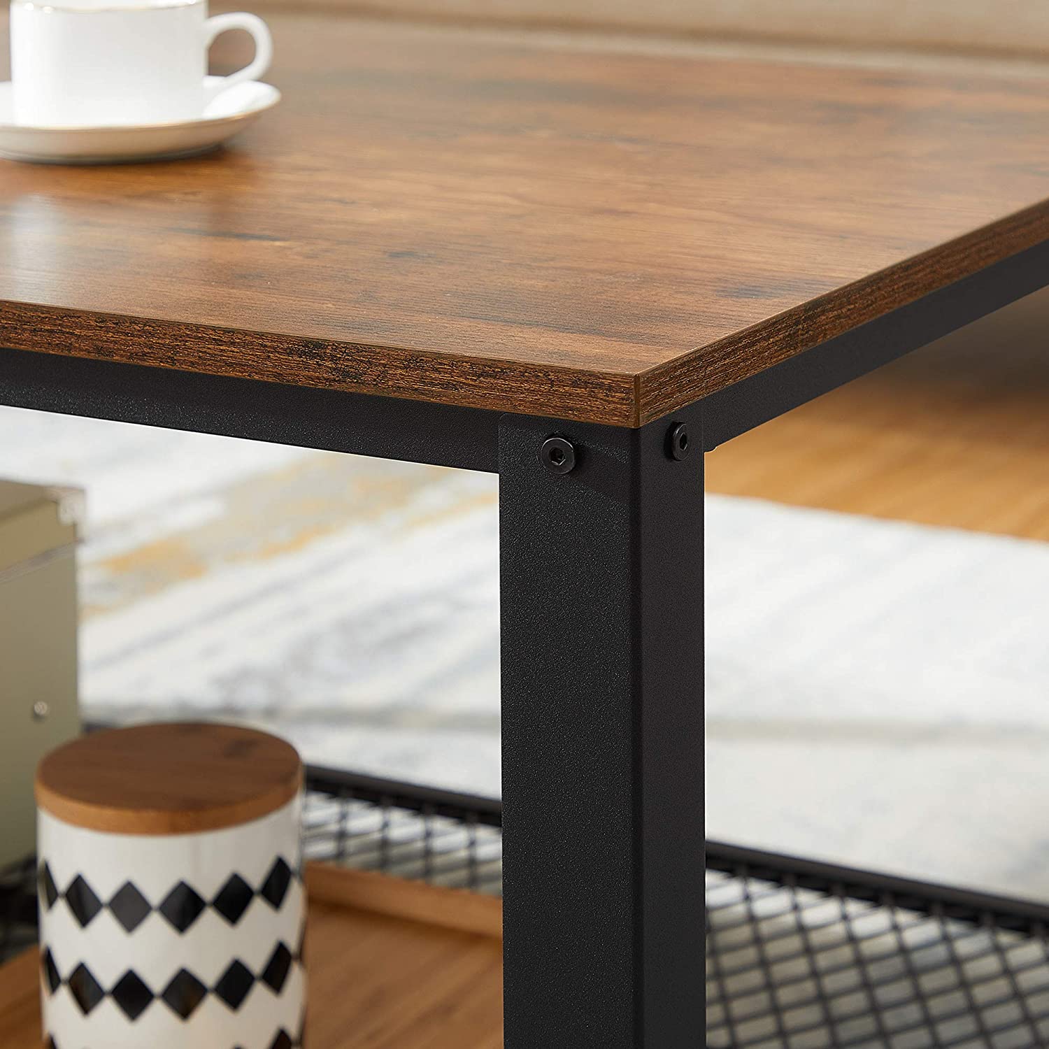 Rustic brown coffee table with metal frame and storage shelf, showcasing a stylish design suitable for any living room.