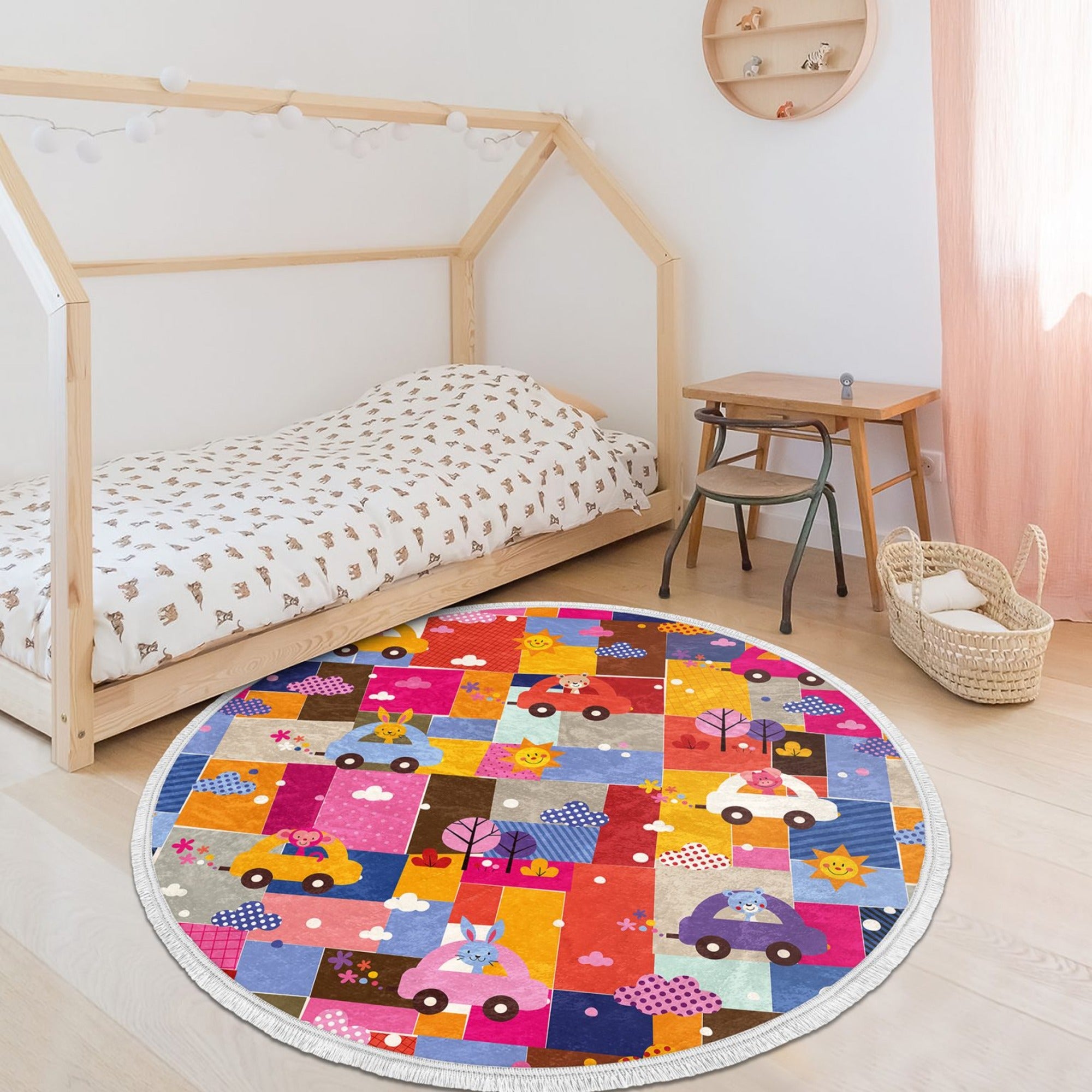 Colorful round rug featuring cute animal prints including a rabbit, monkey, and teddy bear, designed for kids' rooms.