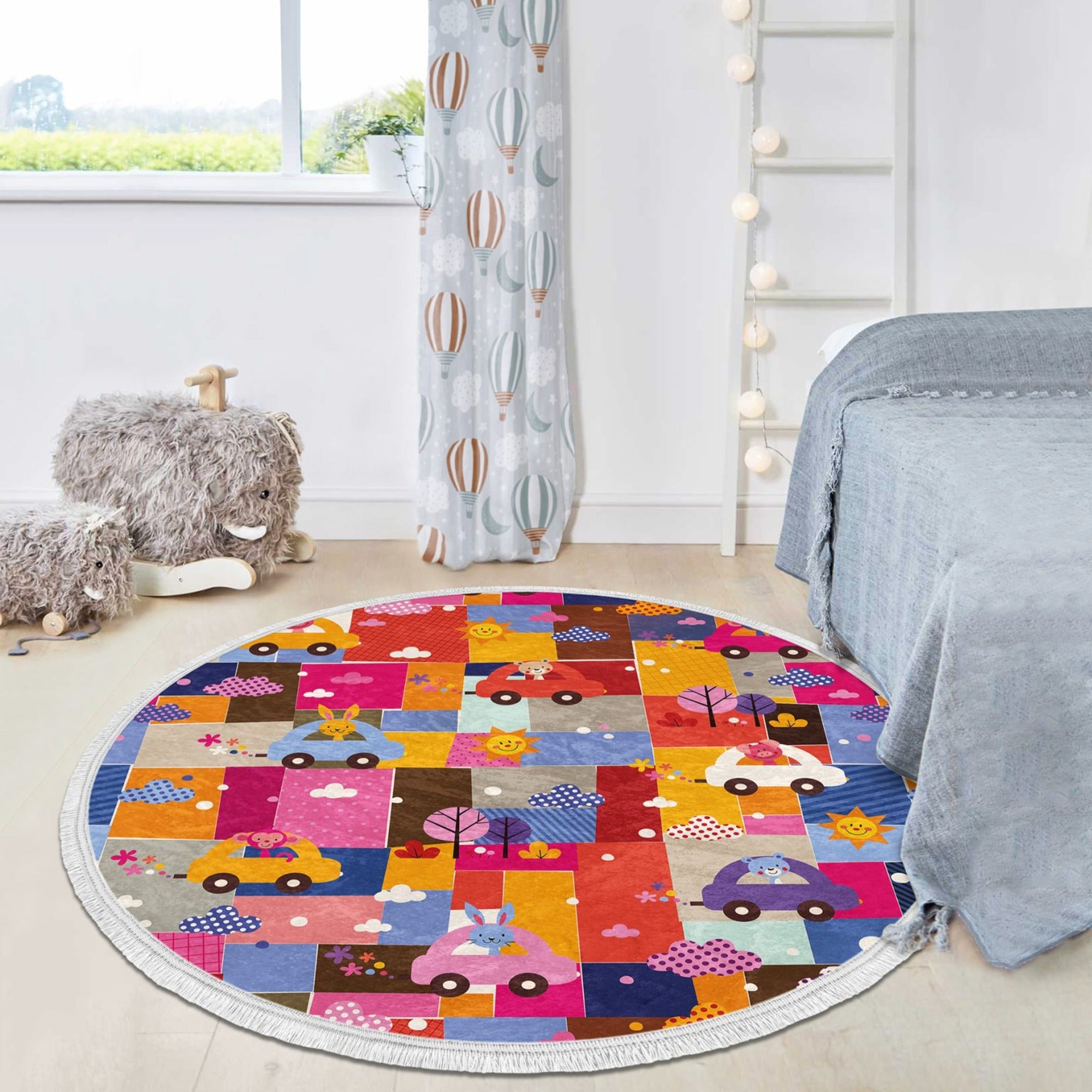 Colorful round rug featuring cute animal prints including a rabbit, monkey, and teddy bear, designed for kids' rooms.