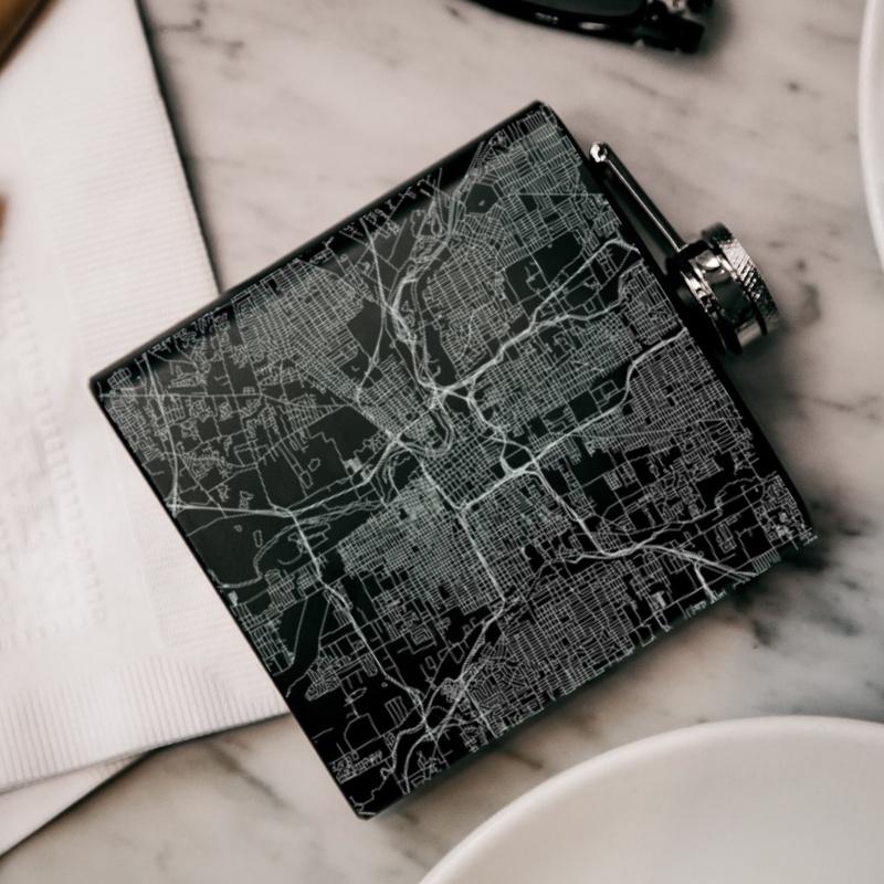 Custom engraved matte black hip flask featuring a map of Columbus, Ohio with coordinates.