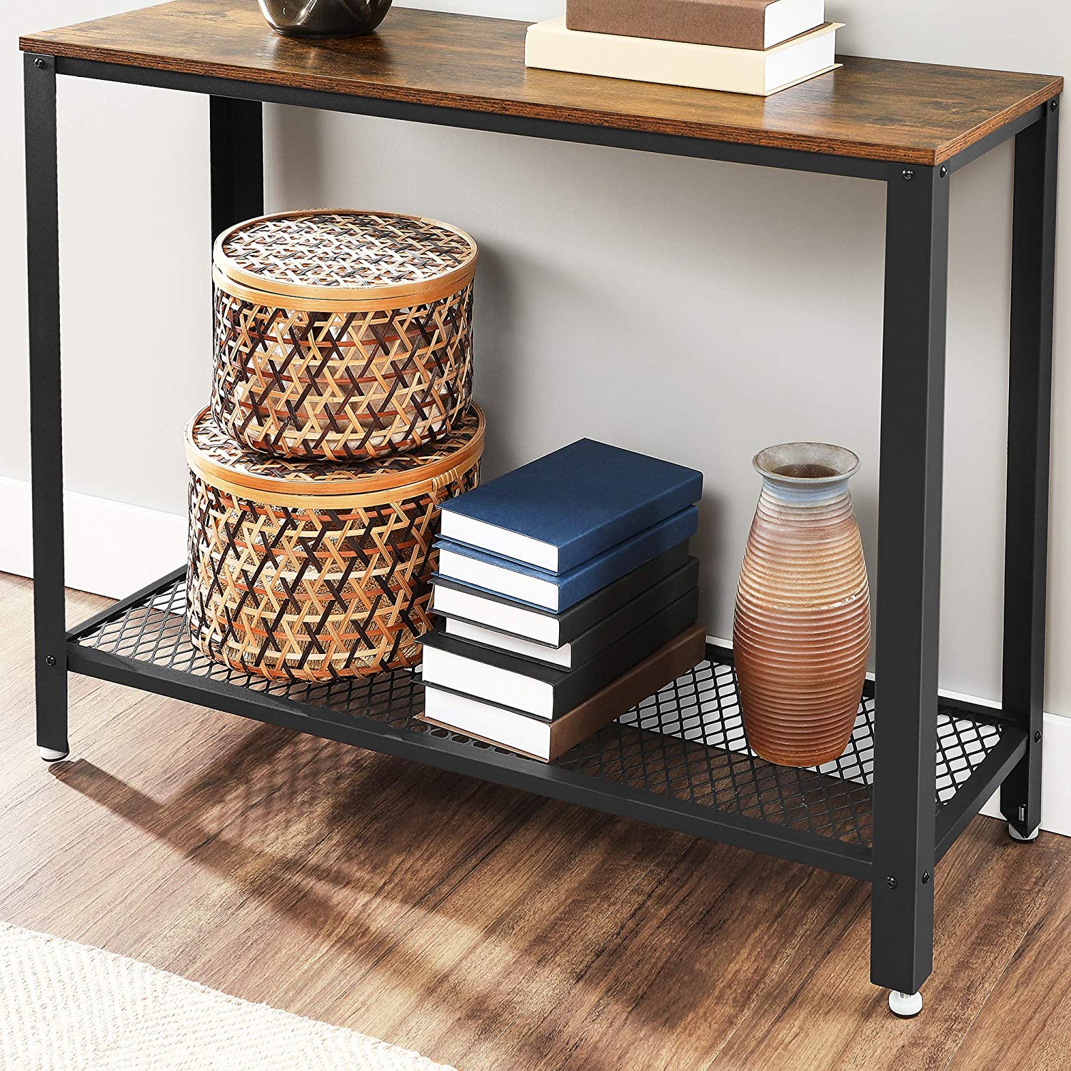 Rustic brown console table with a metal frame, showcasing its industrial design and adjustable feet for stability.