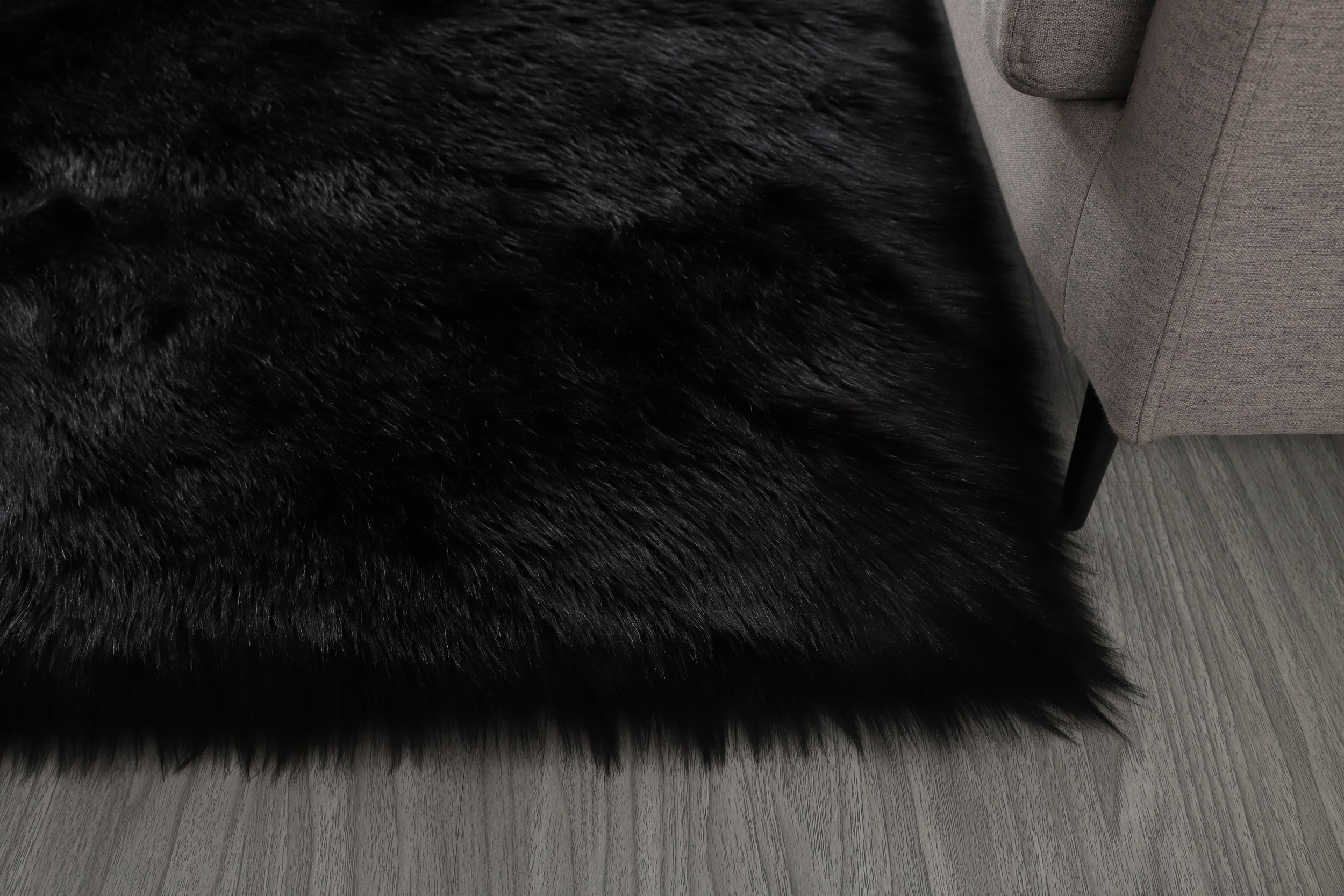 Cozy Ultra Soft Fluffy Faux Fur Black Area Rug showcasing its plush texture and elegant design, perfect for enhancing any living space.