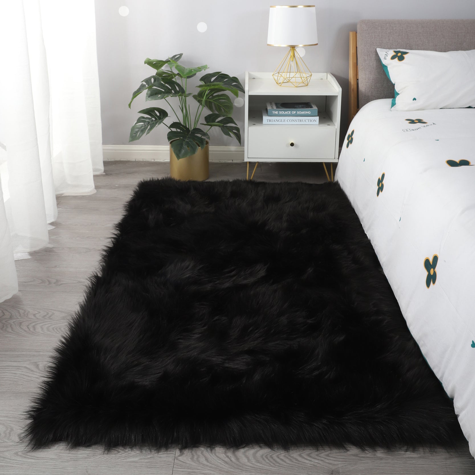 Cozy Ultra Soft Fluffy Faux Fur Black Area Rug showcasing its plush texture and elegant design, perfect for enhancing any living space.