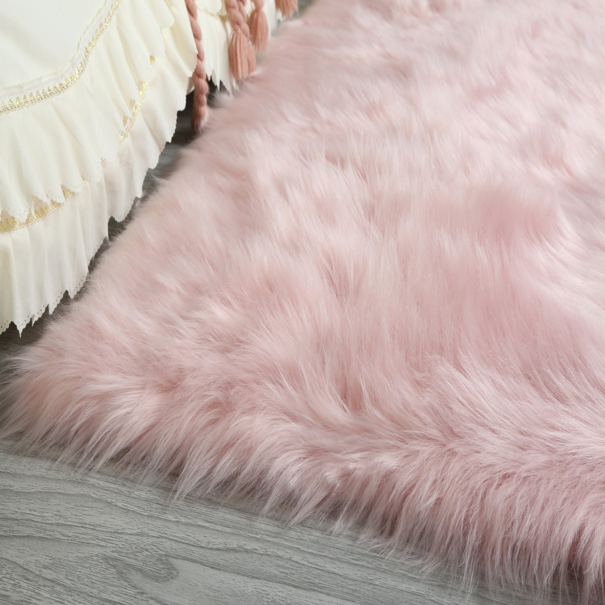 Cozy Ultra Soft Fluffy Faux Fur Pink Area Rug showcasing its plush texture and vibrant color, perfect for enhancing contemporary living spaces.