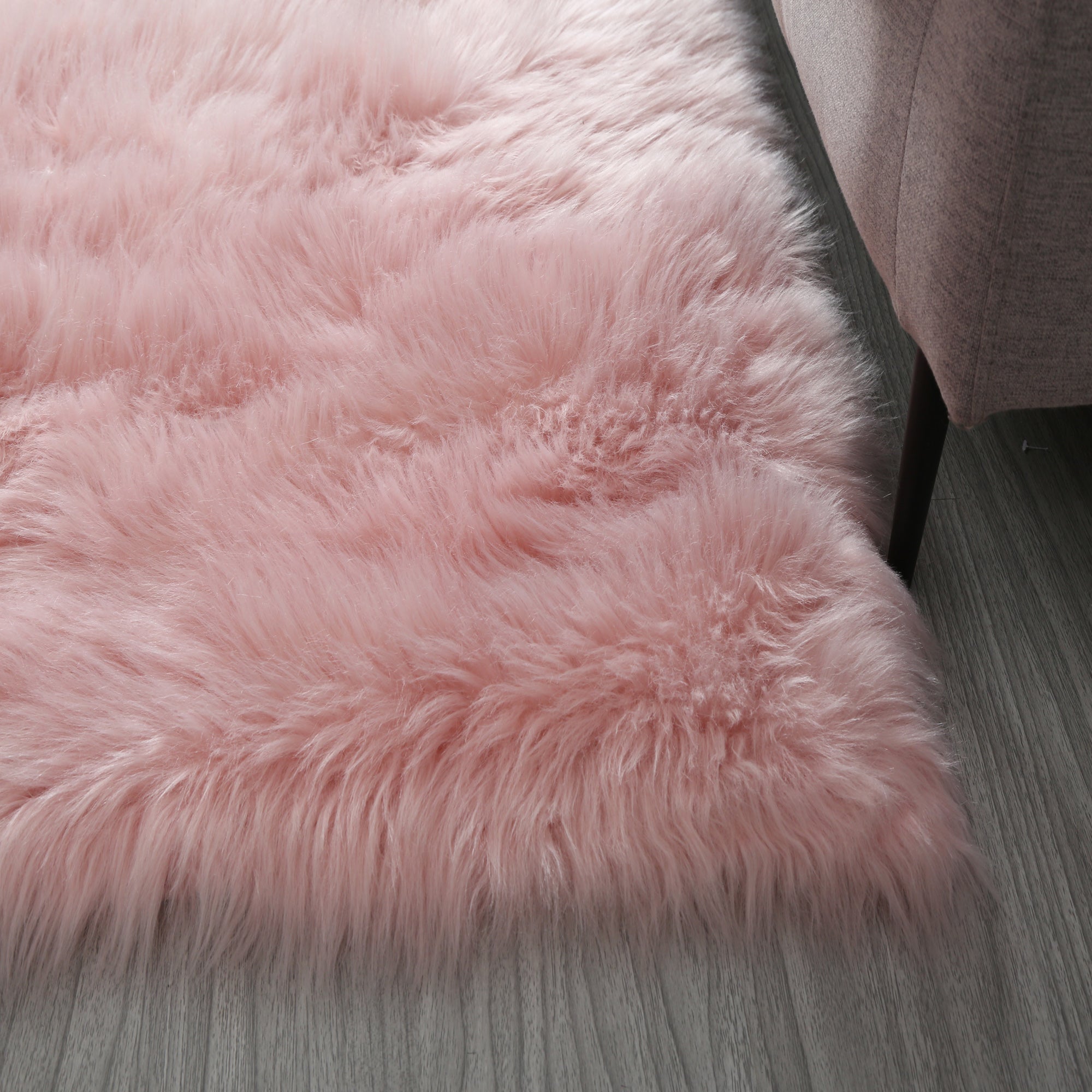 Cozy Ultra Soft Fluffy Faux Fur Pink Area Rug showcasing its plush texture and vibrant color, perfect for enhancing contemporary living spaces.