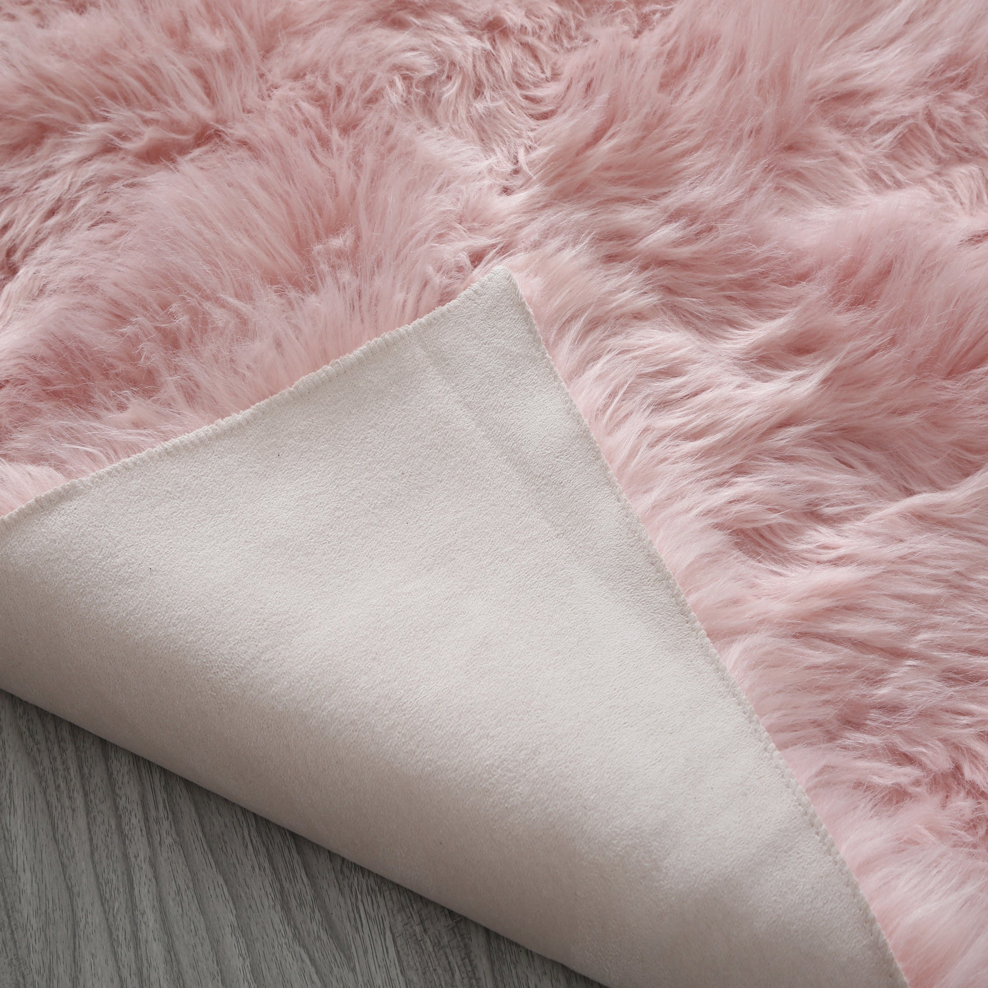 Cozy Ultra Soft Fluffy Faux Fur Pink Area Rug showcasing its plush texture and vibrant color, perfect for enhancing contemporary living spaces.