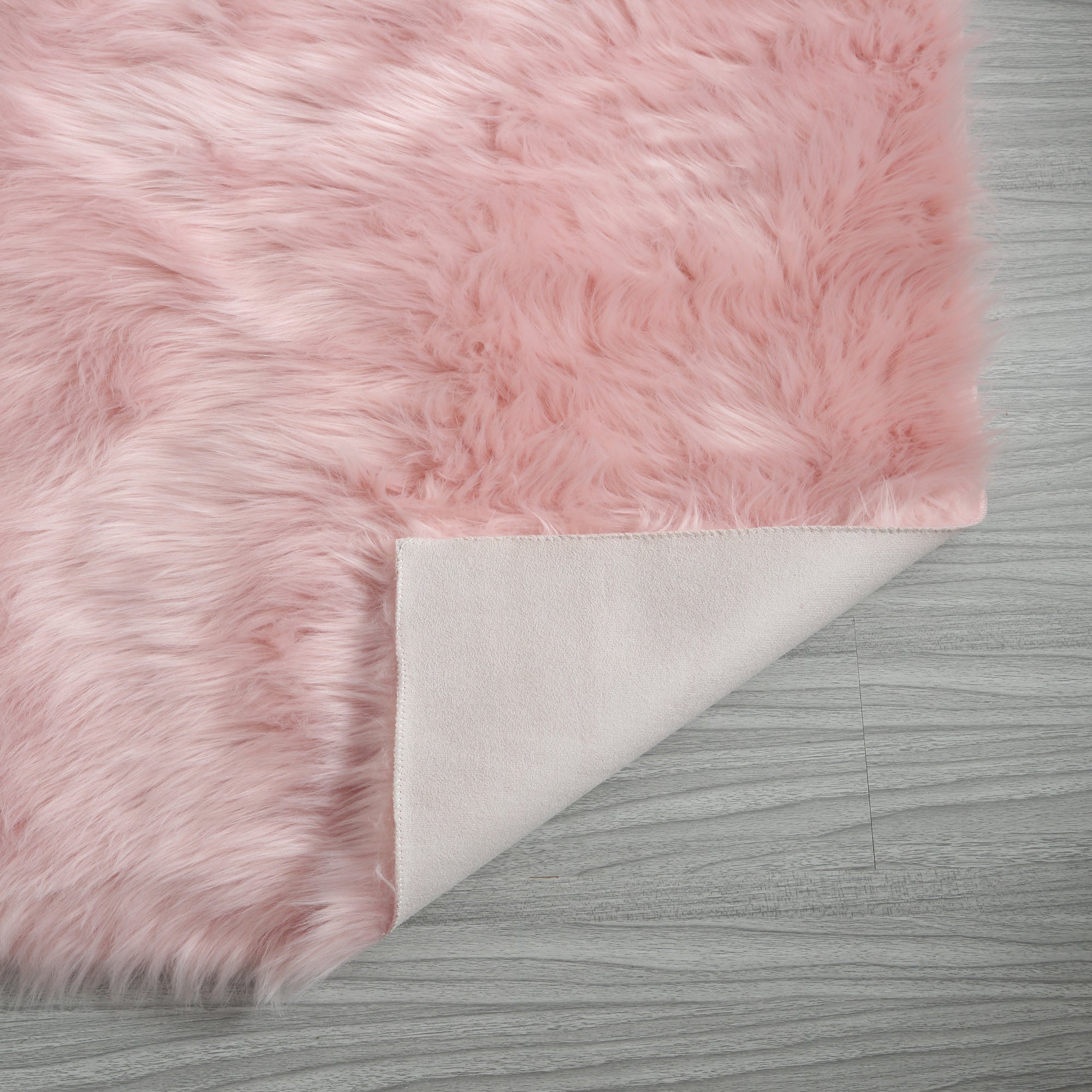 Cozy Ultra Soft Fluffy Faux Fur Pink Area Rug showcasing its plush texture and vibrant color, perfect for enhancing contemporary living spaces.