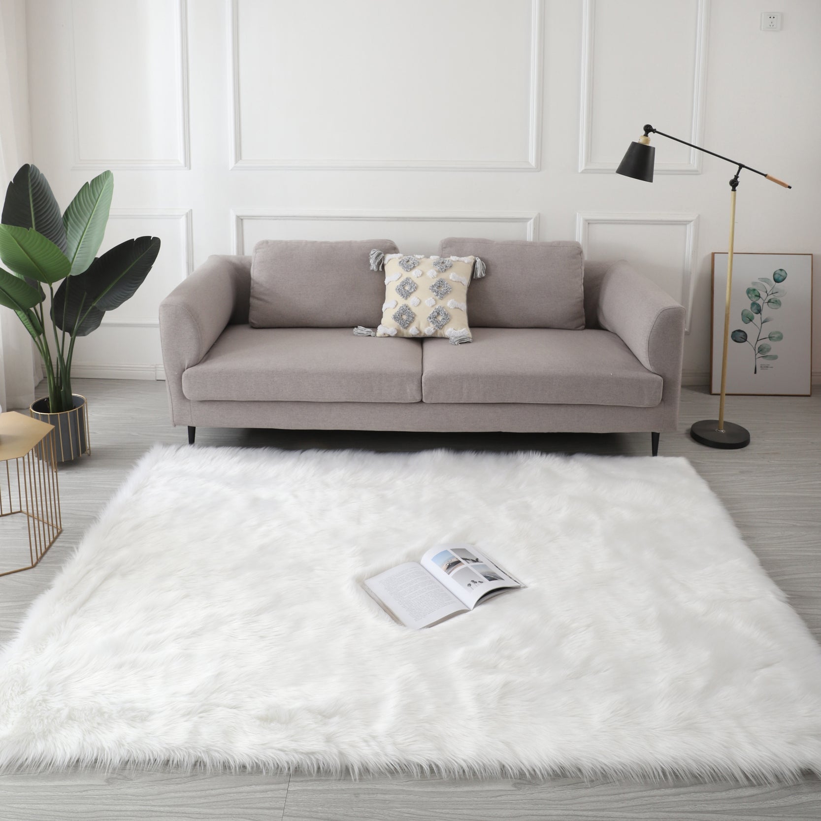 Cozy Ultra Soft Fluffy Faux Fur White Area Rug displayed in a modern living room setting, showcasing its plush texture and elegant design.