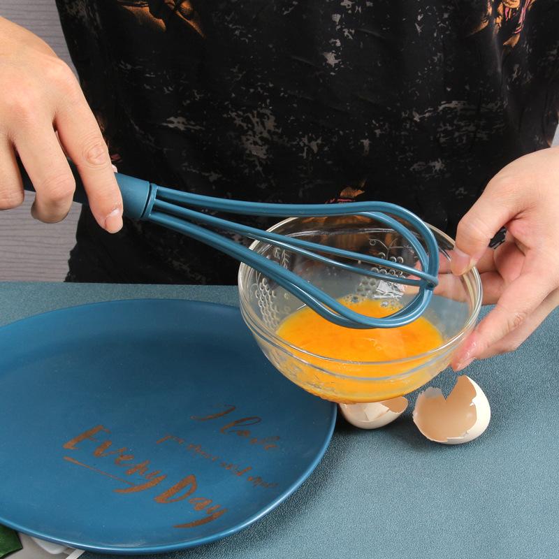 Creative Kitchen Gadget Egg Beater in vibrant colors, showcasing its ergonomic handle and multifunctional design for whipping eggs and mixing ingredients.