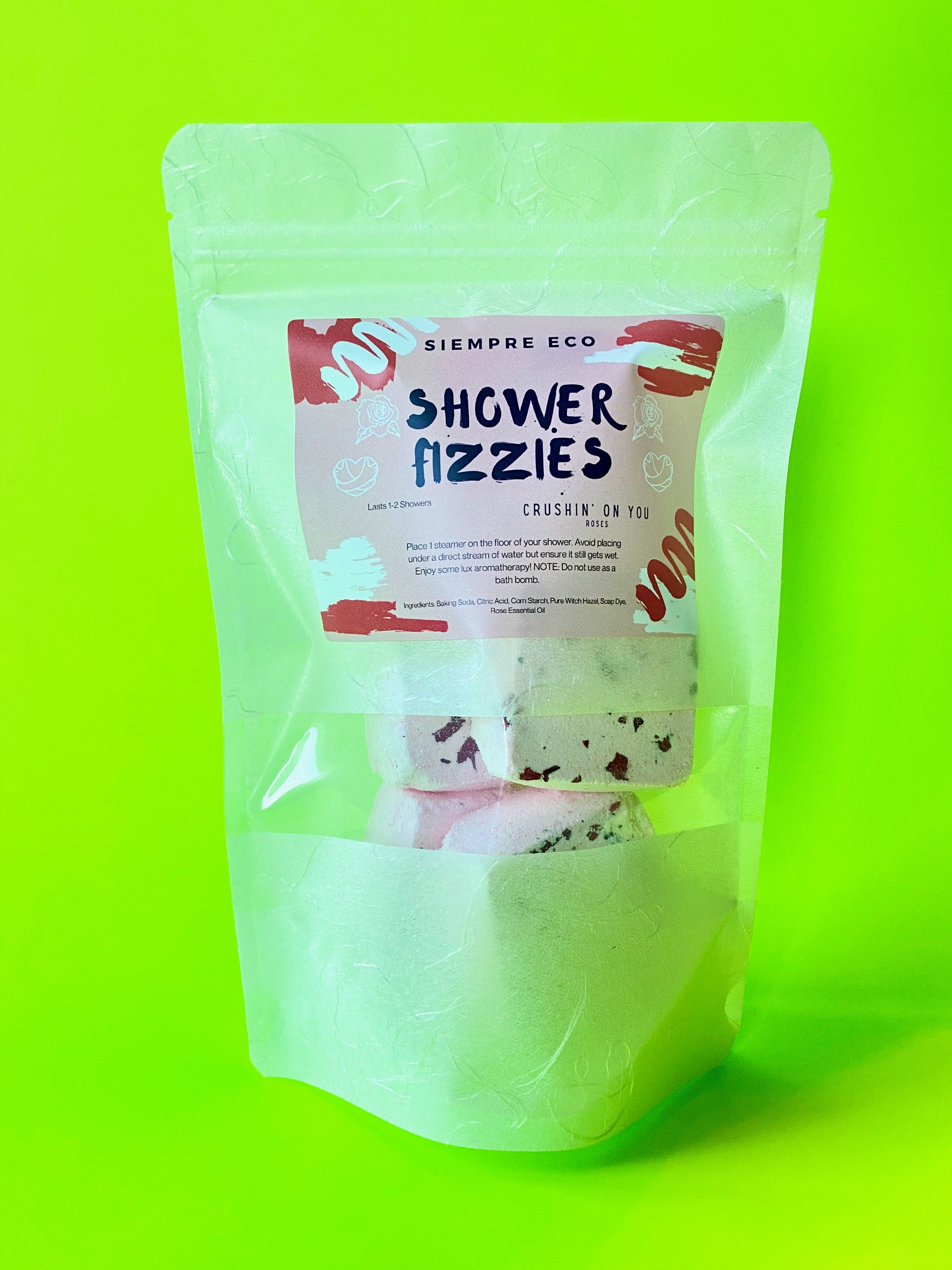 A pack of Crushin' On You Shower Fizzies featuring five colorful fizzies shaped like roses, perfect for aromatherapy showers.