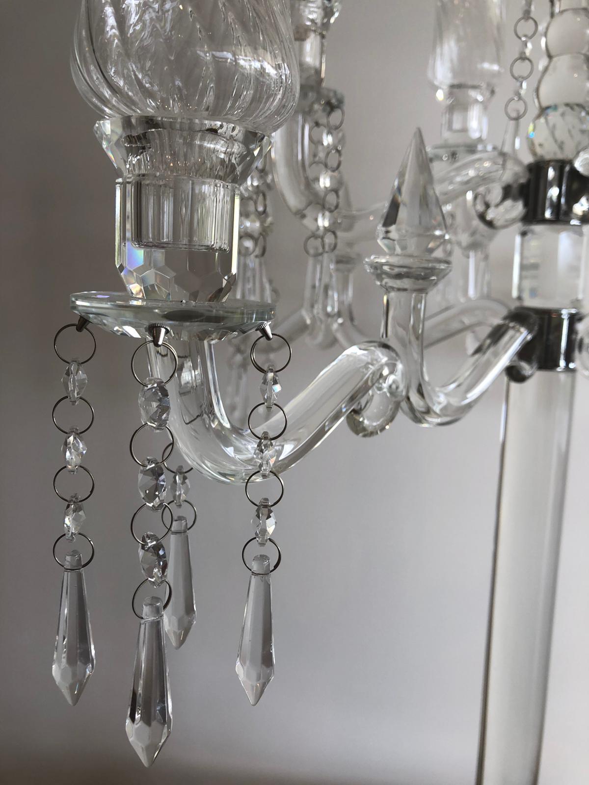 Elegant 9-head crystal candelabra standing 86cm tall, showcasing its intricate design and sparkling finish, perfect for weddings and events.